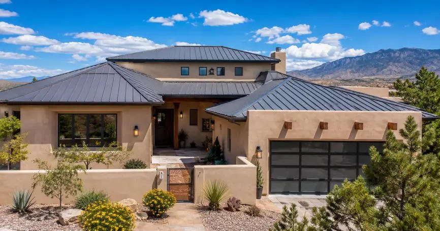 Southwestern home with a charcoal standing-seam metal roof